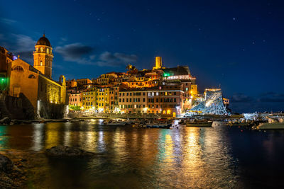 Illuminated buildings in city at night