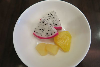 High angle view of fruits in plate on table