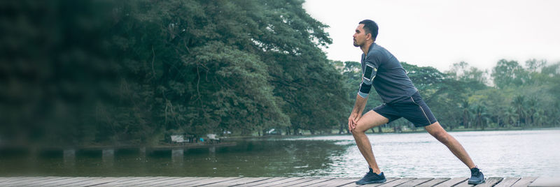 Side view of young man in swimming pool