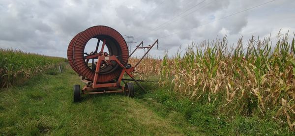 Abandoned wheel on field