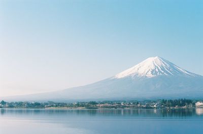 Scenic view of snowcapped mountains against clear sky