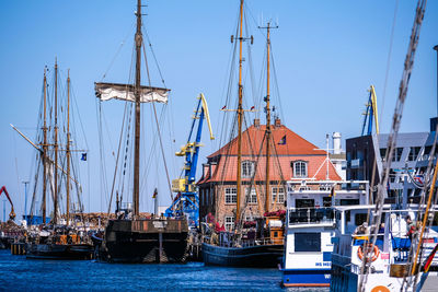 Boats moored at harbor