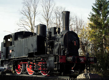 Train on railroad track against sky