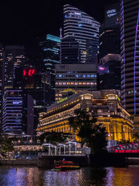 Illuminated buildings in city at night