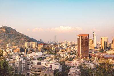 Cityscape against sky during sunset