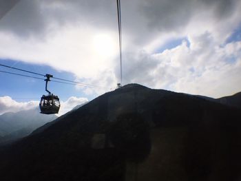 Overhead cable car against sky