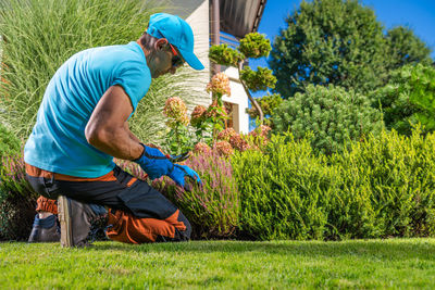 Rear view of man working on field