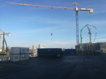 Construction site in city against sky