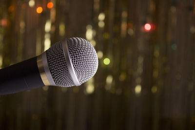 Close-up of microphone against defocused background