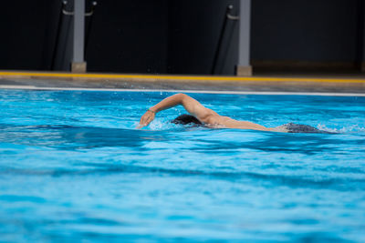 Man swimming in pool