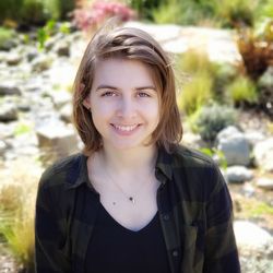 Portrait of smiling girl standing outdoors