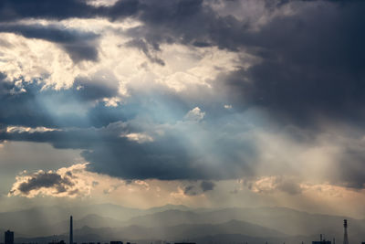 Scenic view of landscape against cloudy sky