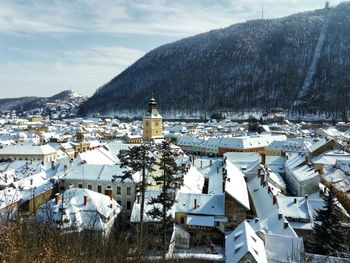 High angle view of houses on snow covered field