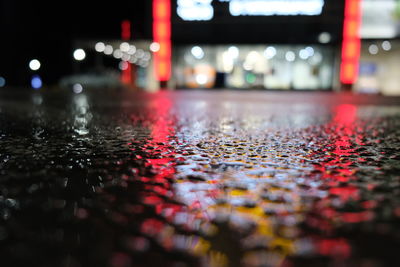 Surface level of wet road at night