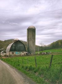 Built structure on field against sky