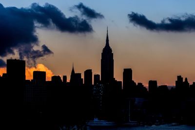 Silhouette of city at sunset