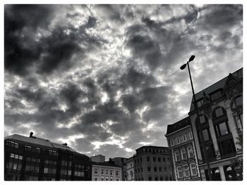 Low angle view of building against cloudy sky