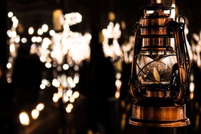 Close-up of illuminated lantern on table