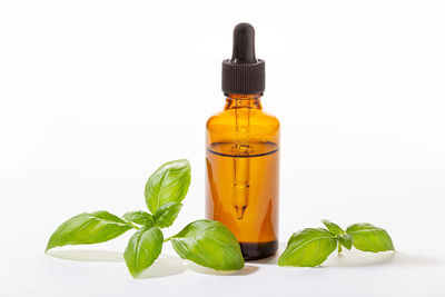Close-up of green bottle against white background