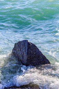 High angle view of rocks in sea