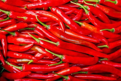 Full frame shot of red chili peppers for sale in market