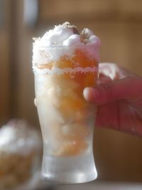 Close-up of hand holding ice cream