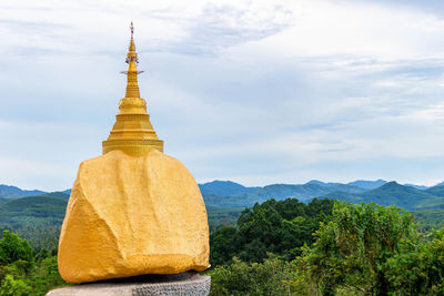 View of a temple against cloudy sky