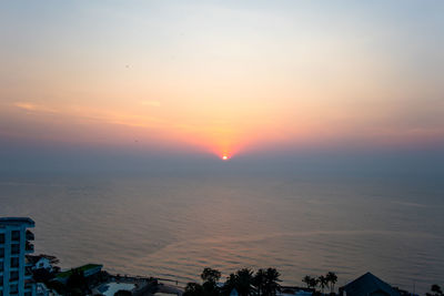 Scenic view of sea against romantic sky at sunset