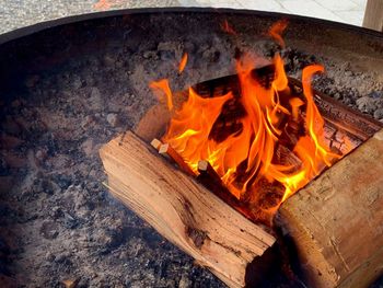 High angle view of fire on wood