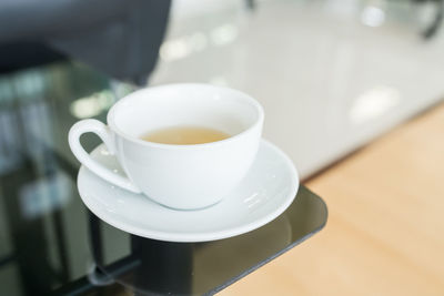 High angle view of coffee cup on table