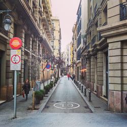 Narrow road along buildings