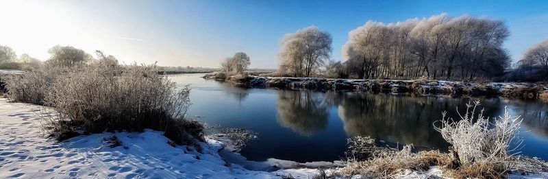 Scenic view of frozen lake against sky