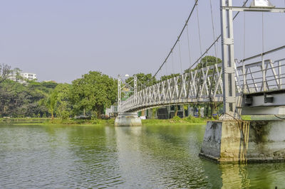 Bridge over river against sky