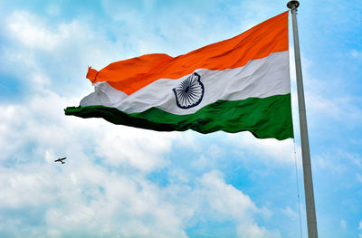 Low angle view of flag against sky