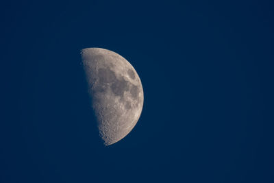 Low angle view of moon against clear sky at night