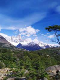 Scenic view of mountains against cloudy sky