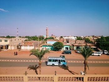 View of town against clear blue sky