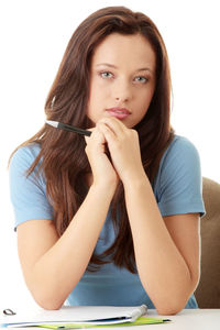 Portrait of a beautiful young woman over white background