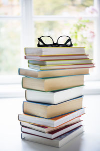 Pile of books with glasses on top, sweden