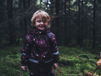 Toddler girl in forest