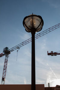 Low angle view of communications tower against sky