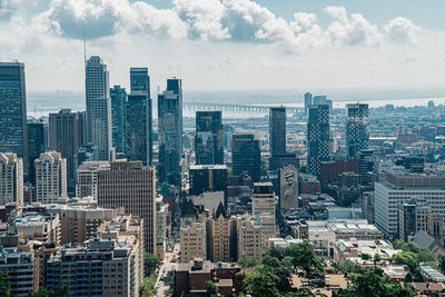 High angle view of buildings in city against sky