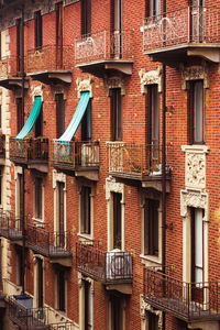 Brick wall with buildings in background