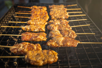 High angle view of meat on barbecue grill