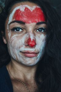 Close-up portrait of woman with face paint