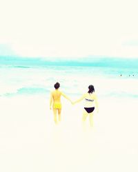 Woman standing on beach