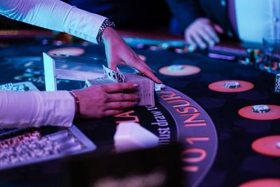 Midsection of man playing piano