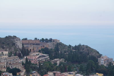 Buildings in city against sky
