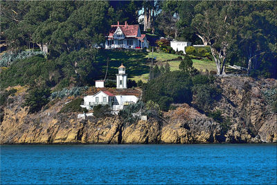 View of sea through buildings