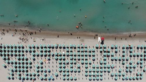 High angle view of people walking on beach